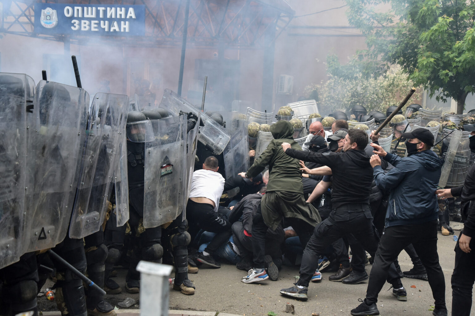 NATO Kosovo Force (KFOR) soldiers clash with local Kosovo Serb protesters in the town of Zvecan